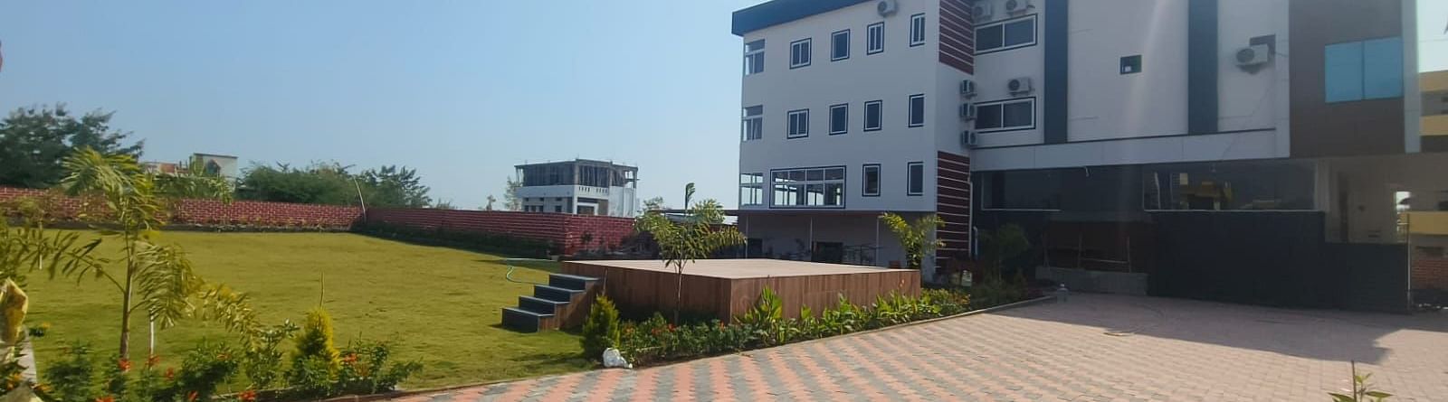 Garden area of ANS M Square Hotel & Resort, Kalaburagi during a sunny day