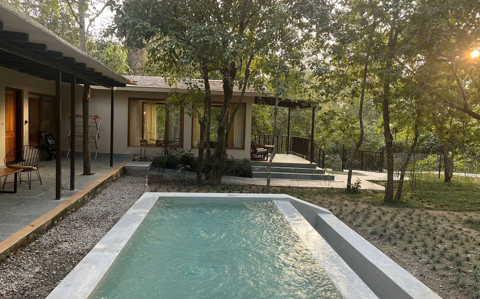 Sanctuary Suite at Saraca Resort & Spa Corbett with a plunge pool surrounded by paved stones amidst the garden