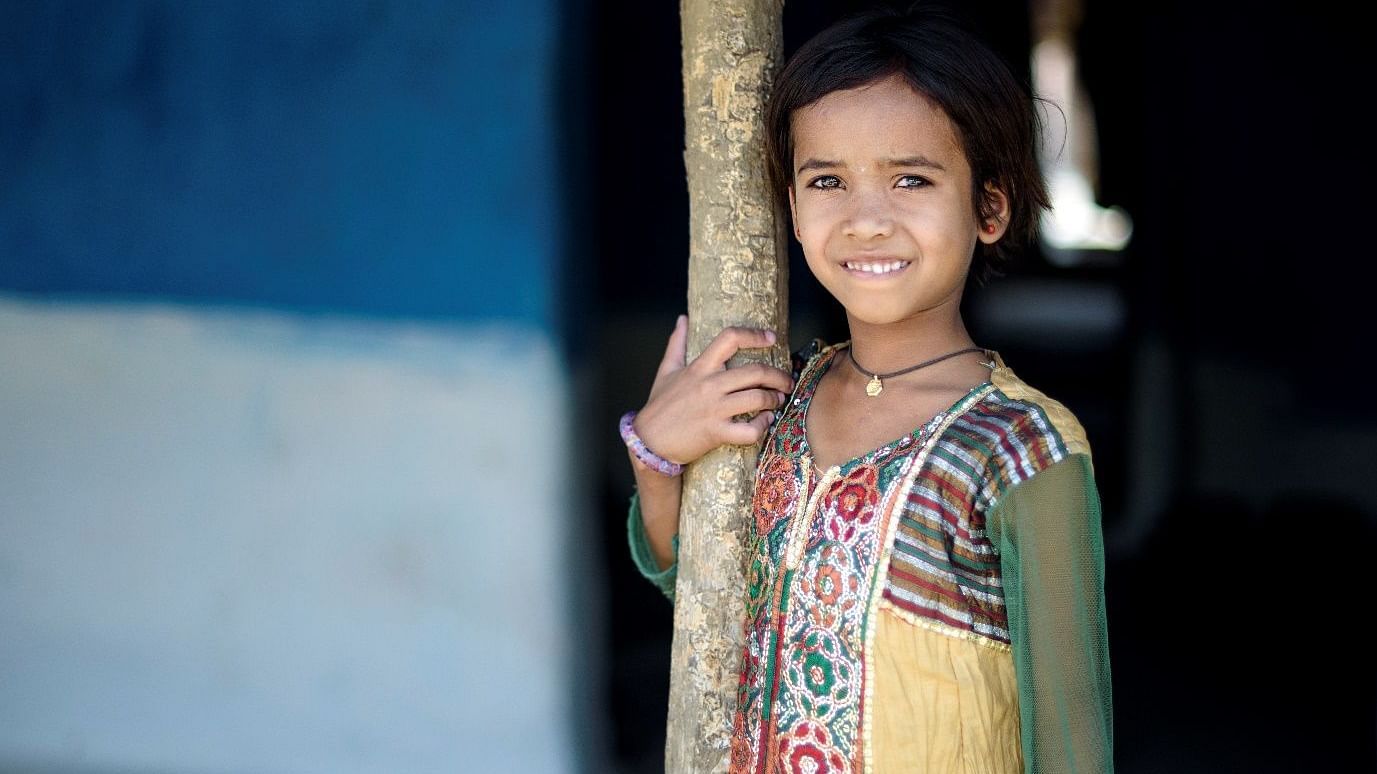 An image of a young smiling girl