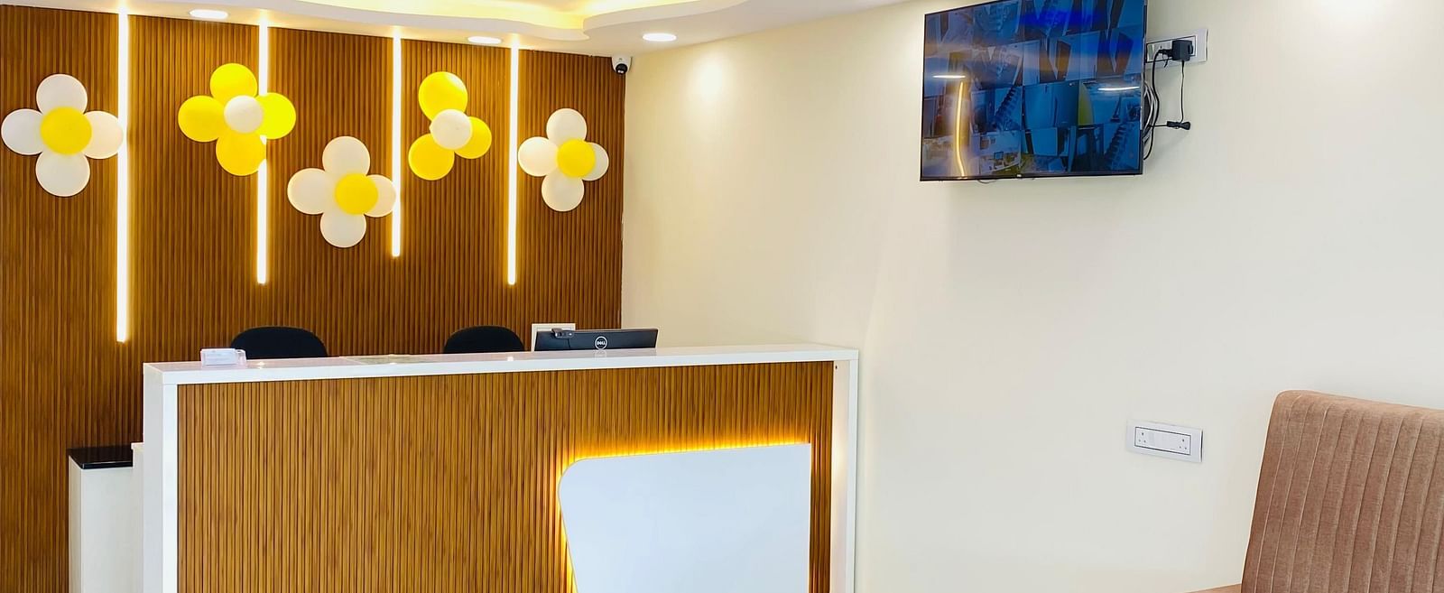 Reception area with stylish lighting and relaxed seating for a warm welcome at Hotel Sahara Tree.