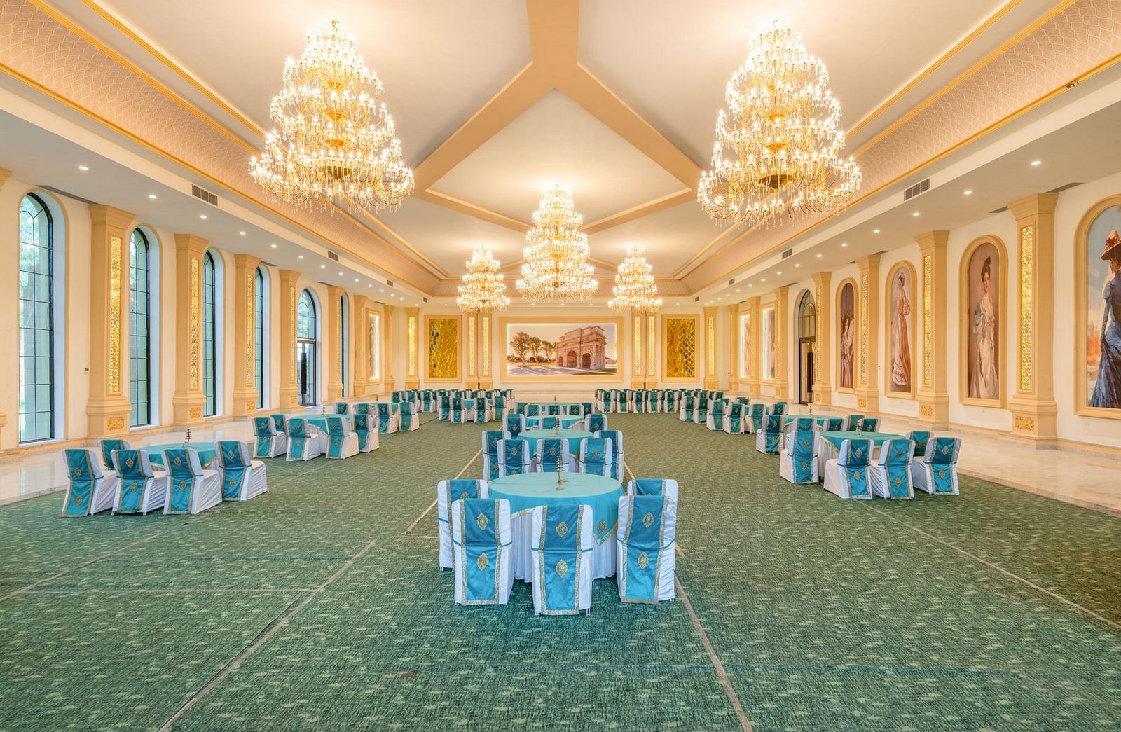 Rear view of a banquet hall at Valley by Grassfield, featuring round tables and chairs.
