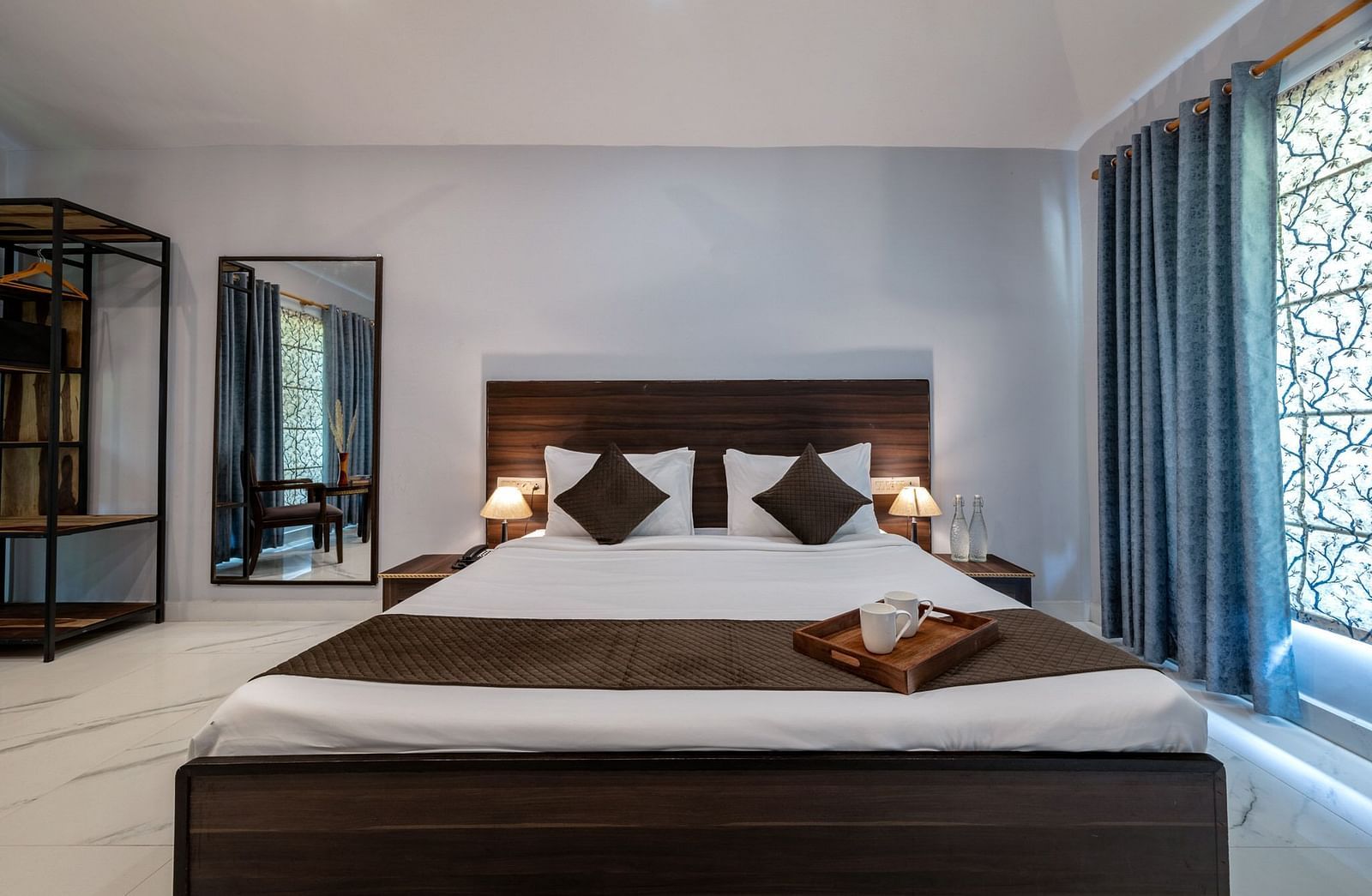 Front view of a room at Valley by Grassfield featuring a bed and a window on the side.