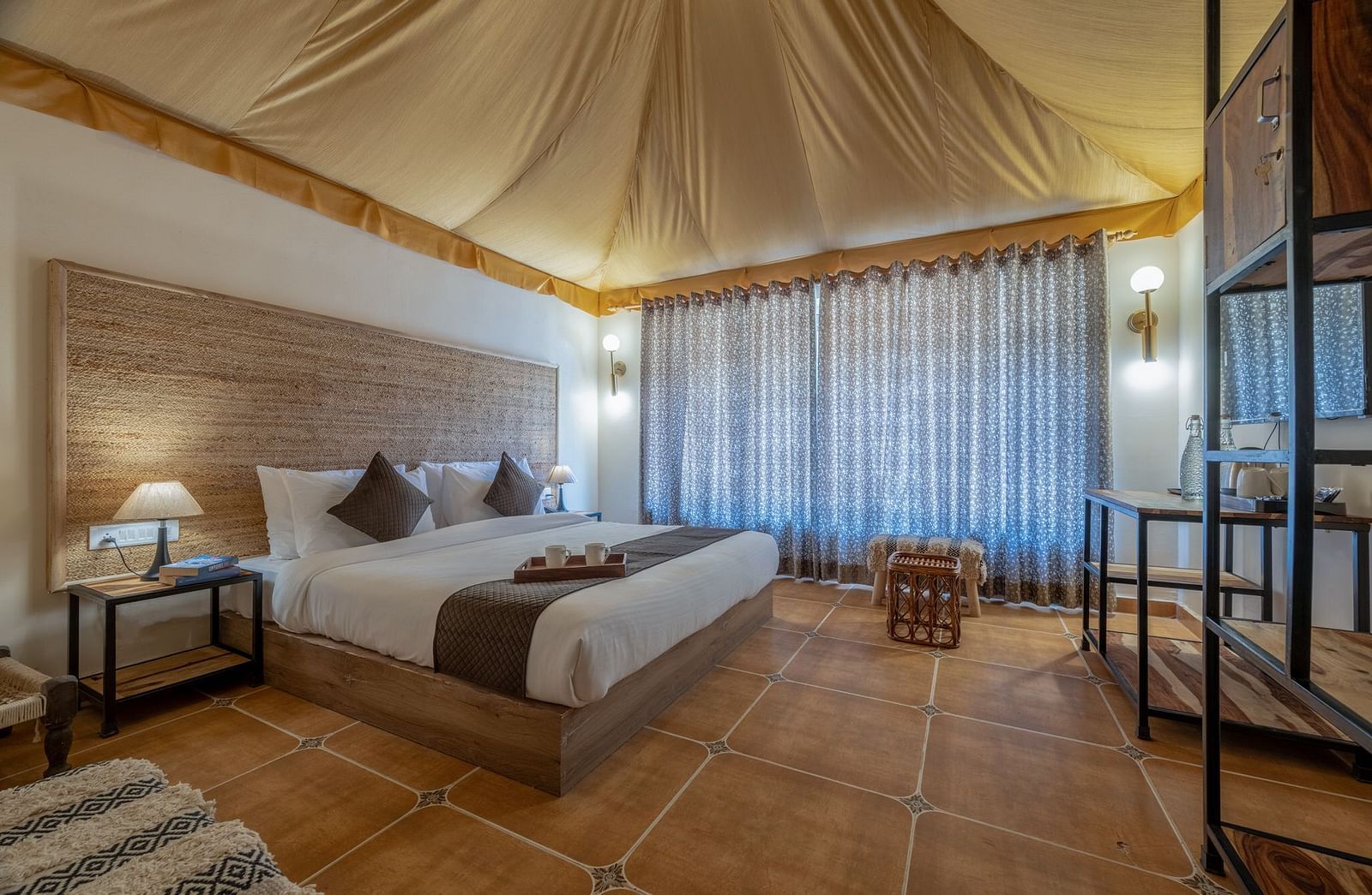 Side view of an accommodation with a bed and a tented ceiling at Valley by Grassfield.