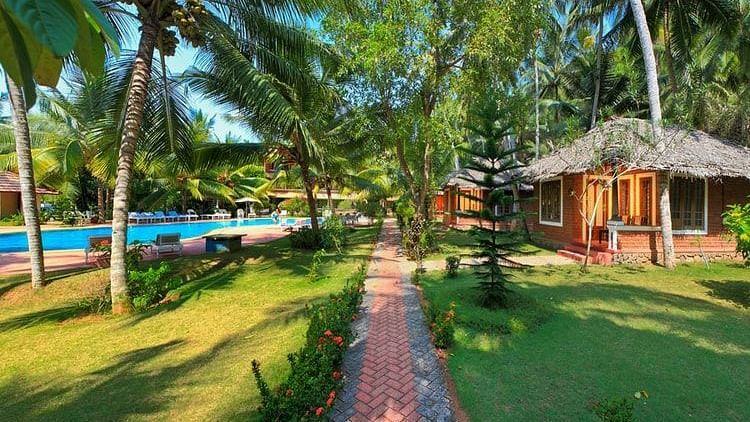 abad-harmonia-resort-green-walk-pool-to-cottage