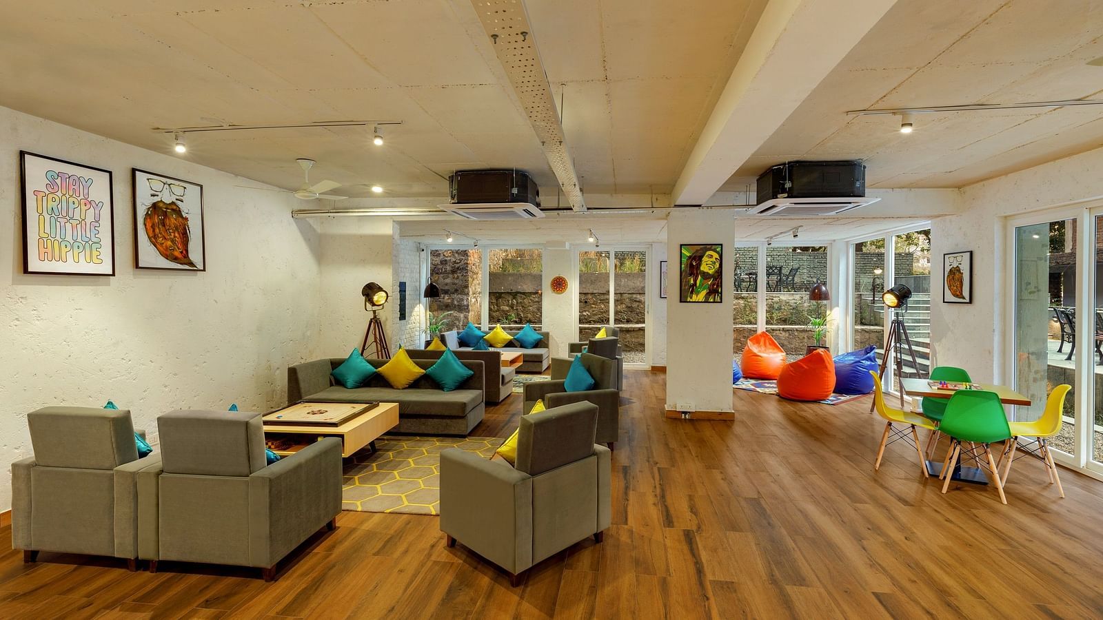 Cosy seating area with carom board and chessboard for leisure and games at Bedzzz, Rishikesh