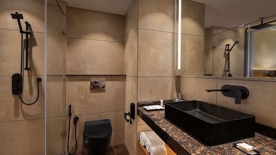 Premium peaks washroom vanity area with black faucets