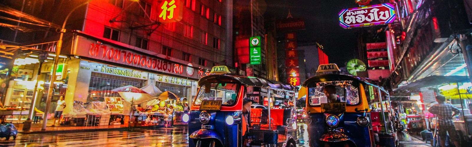 an image of chinatown area in thailand captured in a way that potrays the vibrant night life there