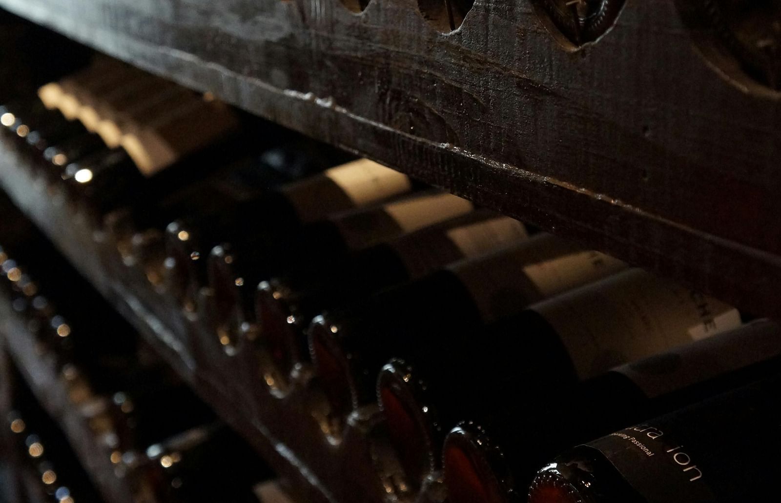 An array of wine bottles placed in a wine cellar - Alibu Resorts Nha Trang