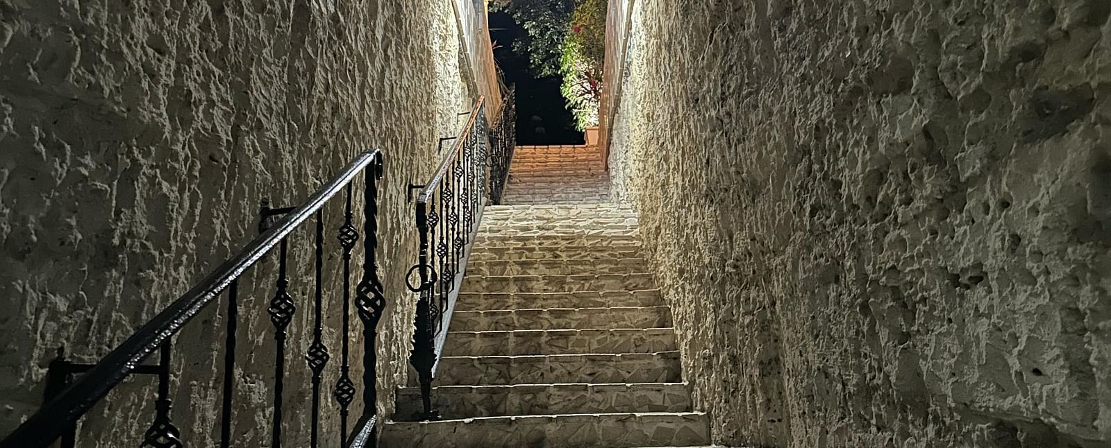 A low angle of a narrow stone staircase