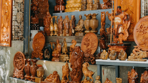 A shop filled with wooden carvings and figurines
