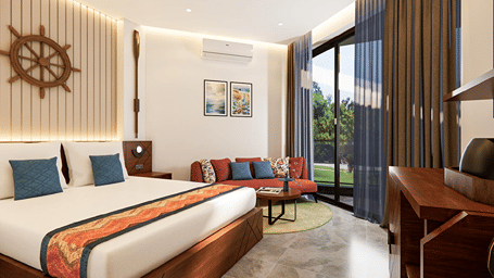 Sunlit resort guest room with a king bed, nautical ship wheel wall art, red settee sofa, and sliding doors to a private balcony.