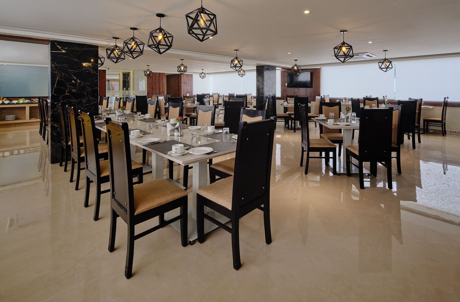 Dining arrangement at Blue Salt and Coffee at Essentia Premier Hotel, Chennai