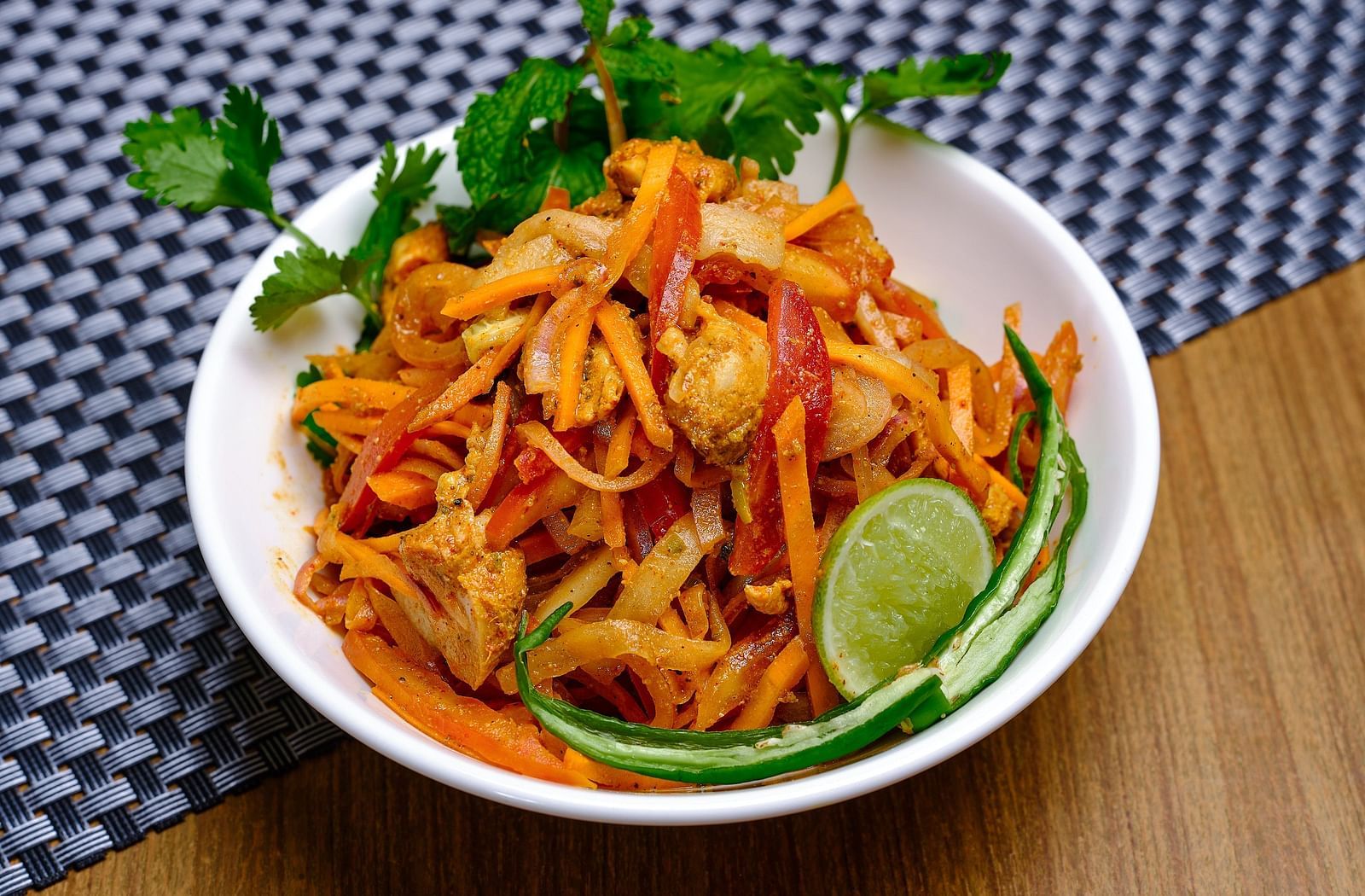 A bowl of salad placed on a table - Essentia Premier Hotel, Chennai