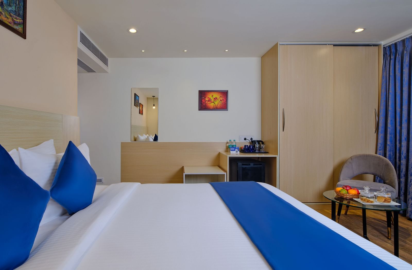 A room at Essentia Premier Hotel, Chennai with a double bed and a wardrobe