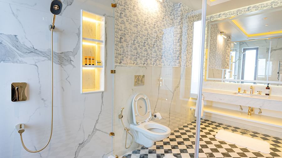A bathroom with a wall-mounted shower head and a bathtub  - The Manor Luxury Hotel, Shimla