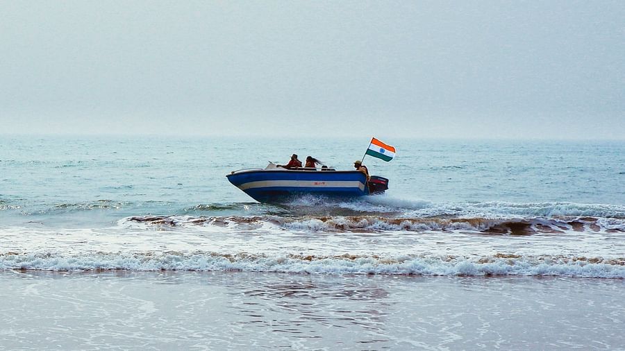 a speed boat cruising across a river in Konark