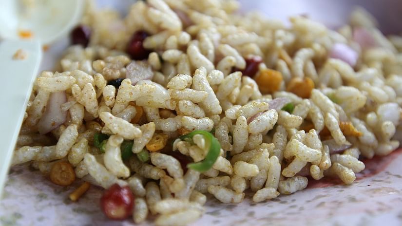 Puffed rice mixed with tangy chutney and groundnuts