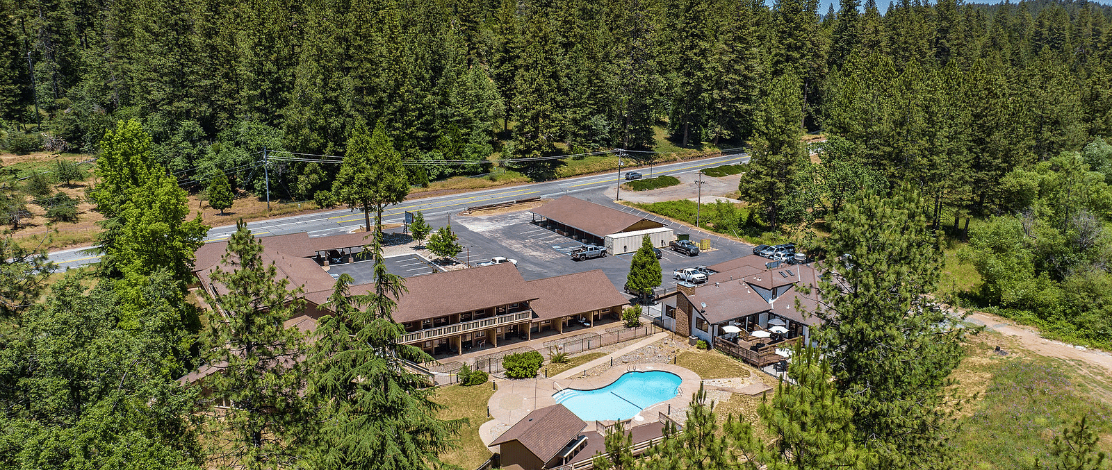 Aerial view of Amador Hotel with a forest in the backdrop.