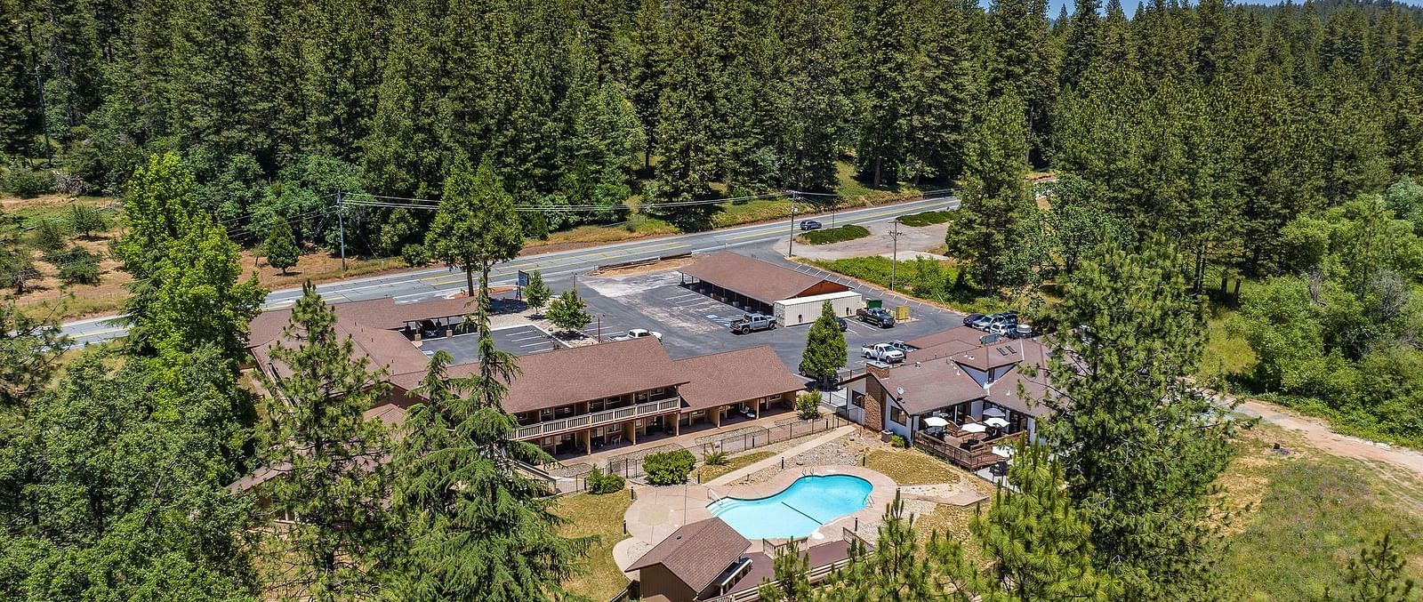 Aerial view of Amador Hotel with a view of the forest in the backdrop