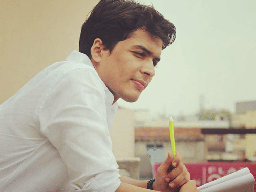 Shivendra Pratap Singh leans over a railing.