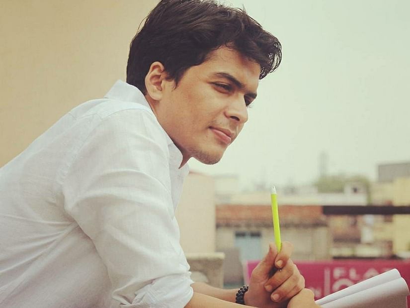 Shivendra Pratap Singh leans over a railing.