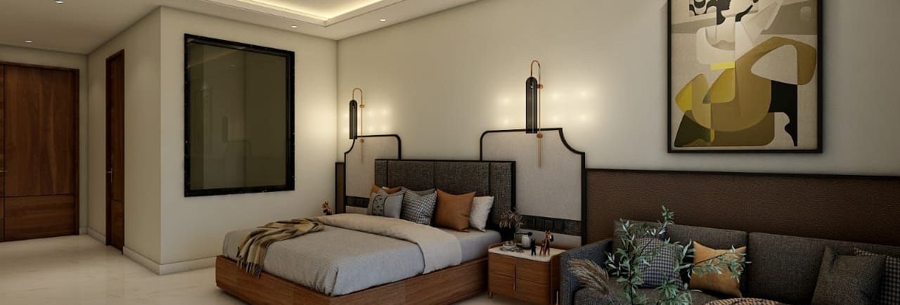 A bedroom with slightly low lighting featuring a double bed with an artistic head board along with a common seating area besides it. - Namaste Corbett