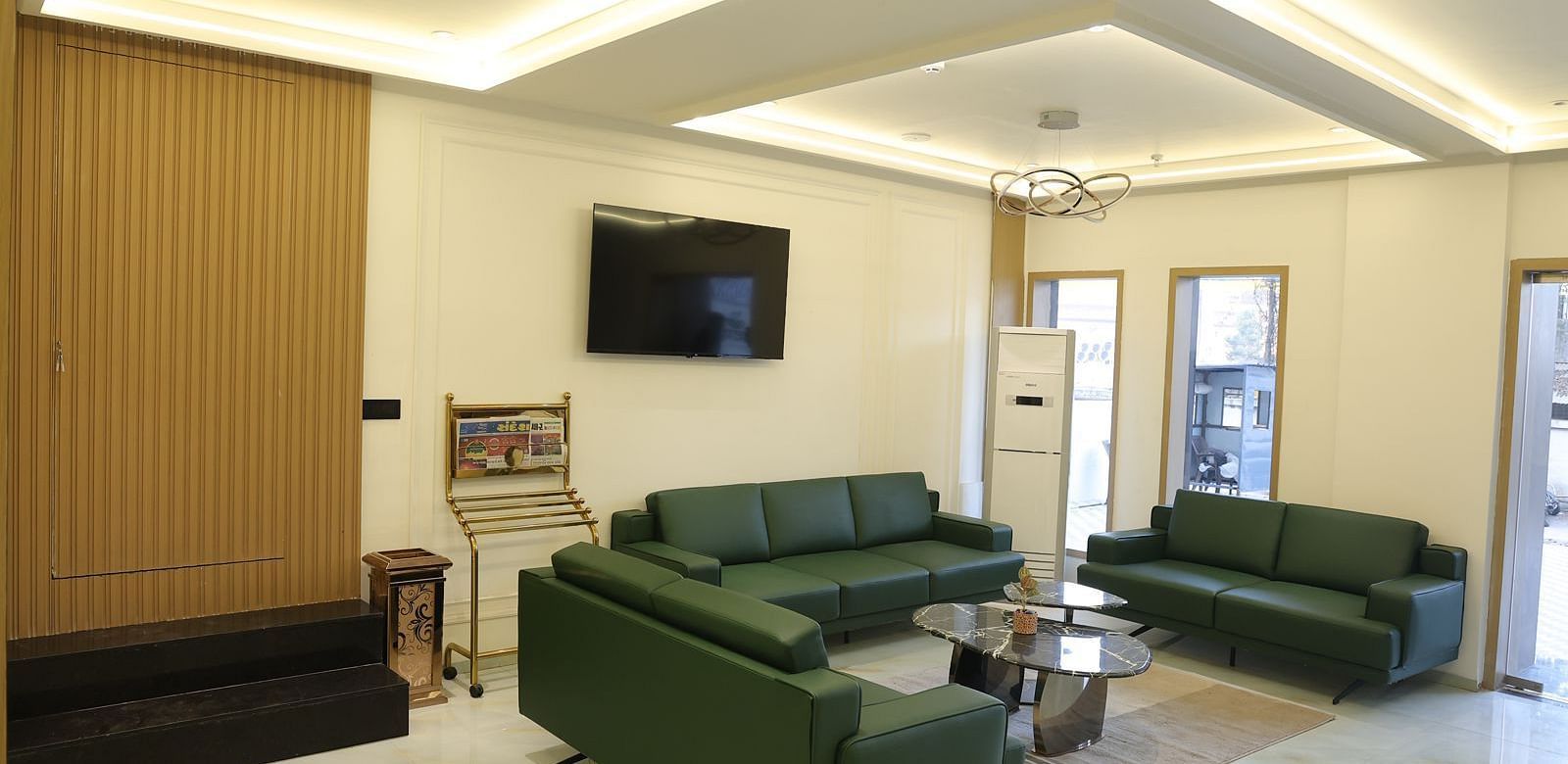 A welcoming reception area at Lords Eco inn Jamnagar Maheshwari Nagar featuring comfortable seating and a modern aesthetic.