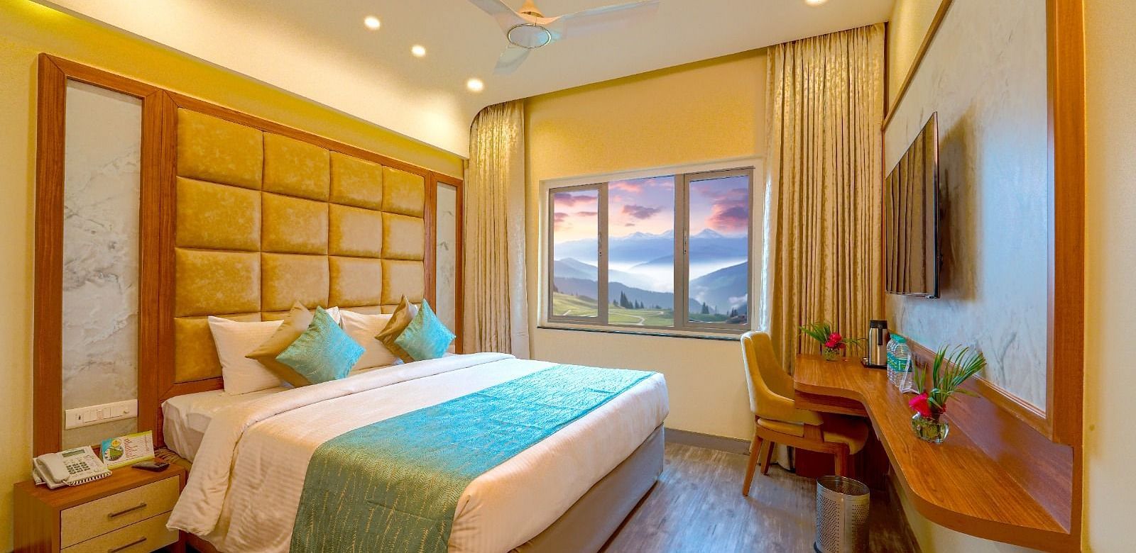 Cozy bedroom with a queen-sized bed, elegant headboard, and large window offering natural light Tara, Comfort Hotel in Hyderabad - Ramoji Film City.