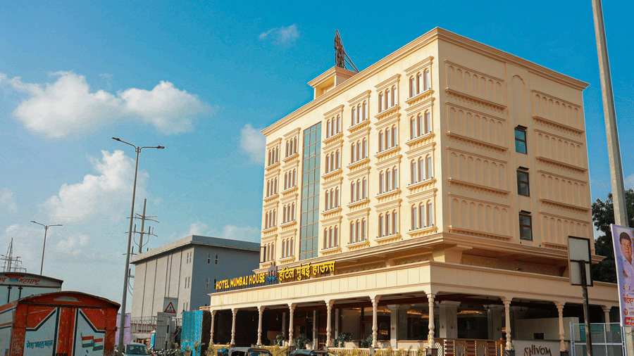 Exterior view of the hotel building under a clear sky at Hotel Mumbai House Digha, Airoli.