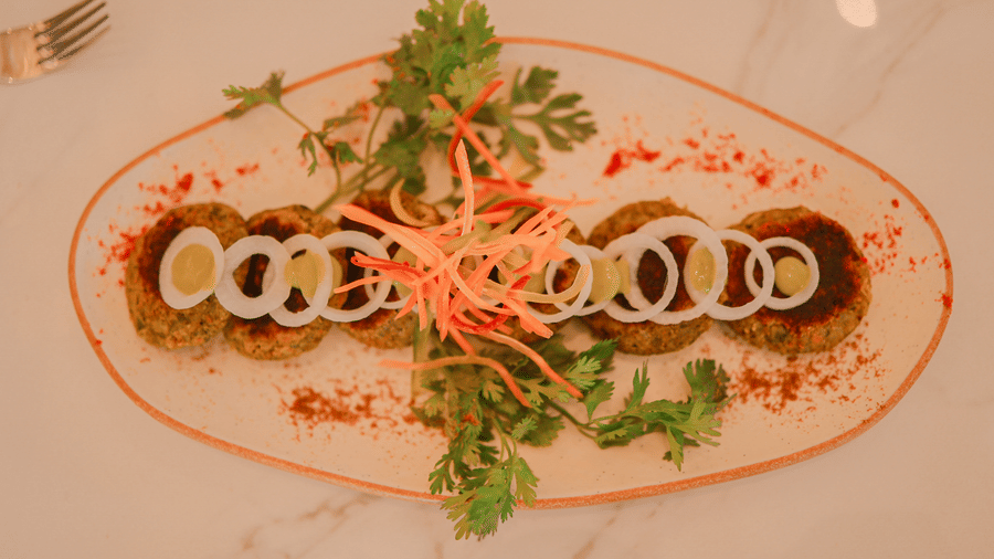 Plated appetiser garnished with herbs at Hotel Mumbai House Digha, Airoli.
