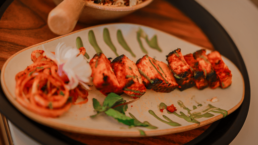 Plated grilled dish served with pasta at Hotel Mumbai House Digha, Airoli.