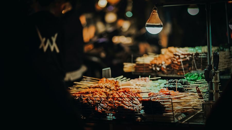 a wide variety of seafood displayed on a table with a lamp placed over it