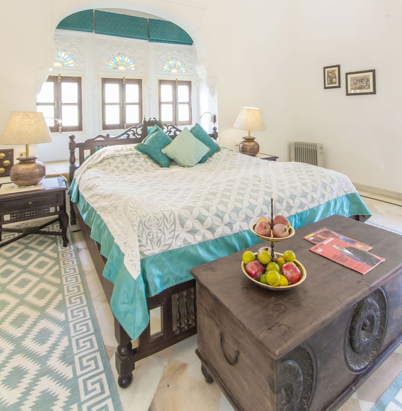 an image of a room with a double bed with ample natural light at dev shree, deogarh
