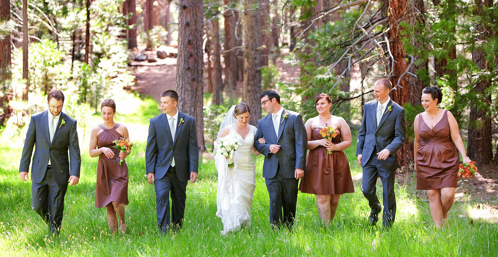 a bride and groom walking next to their best mans and bridesmaids - The Groveland Hotel