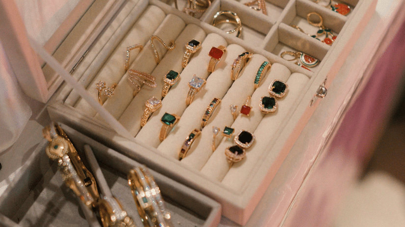 A detailed view of several different types of bangles and bracelets arranged neatly in a display.