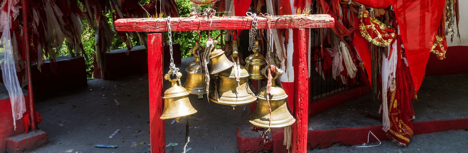 An image of temples bells in a traditional indian temple.