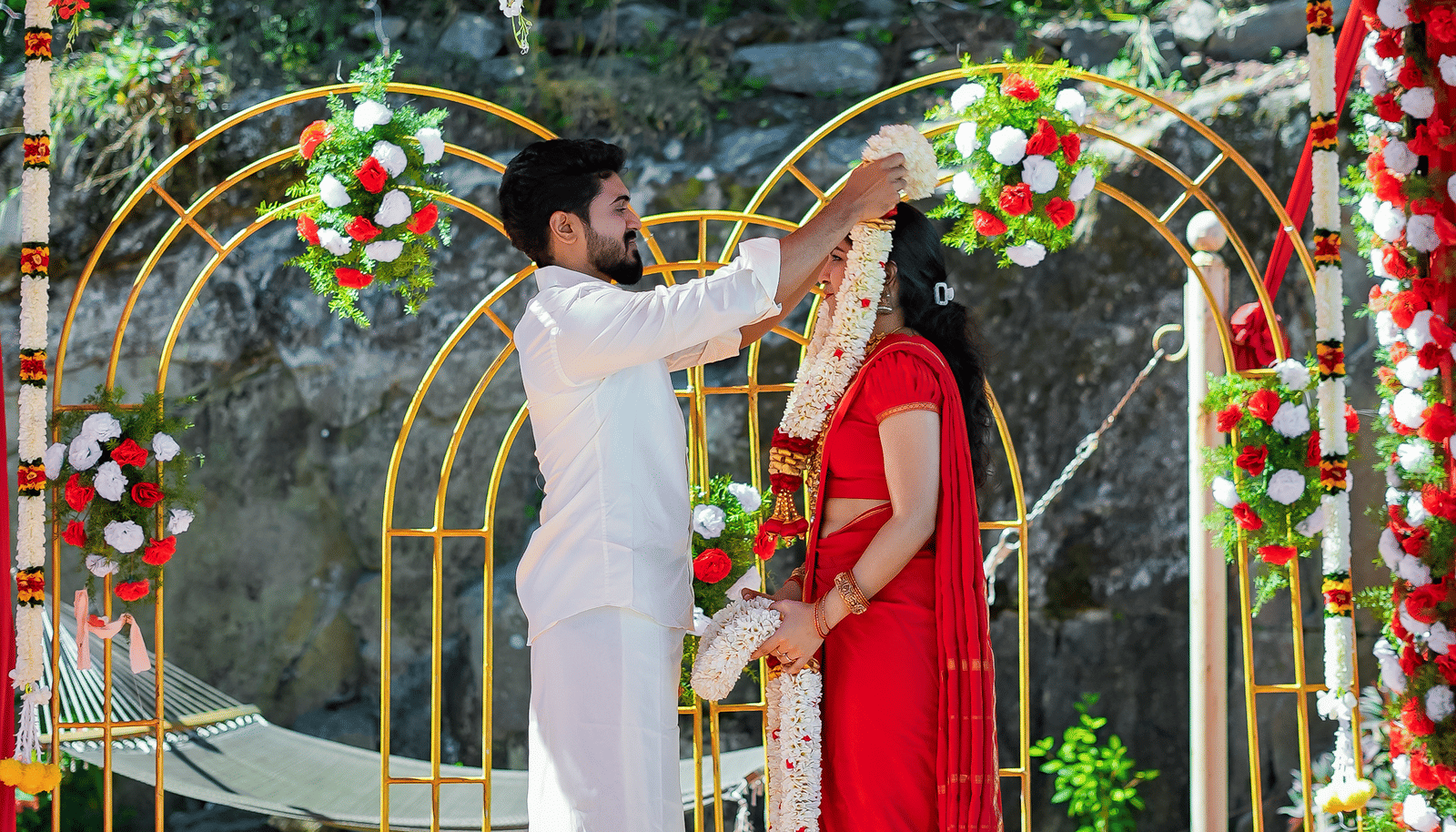  Outdoor wedding mandap at Grand Palace, Yercaud, floral hanging décor, couple holding hands, stages, floral mats, backdrop and soft lighting for ceremony