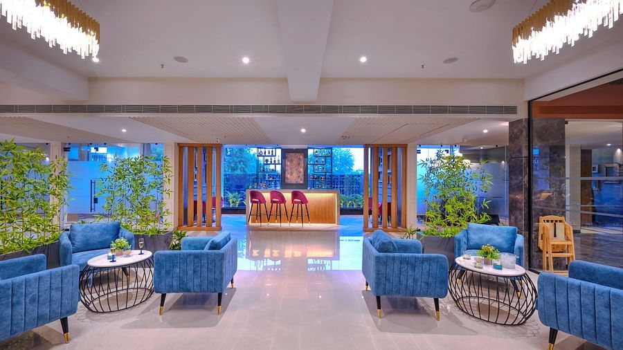 A bar with a well-maintained seating arrangement - Royale Sarovar Portico, Agra