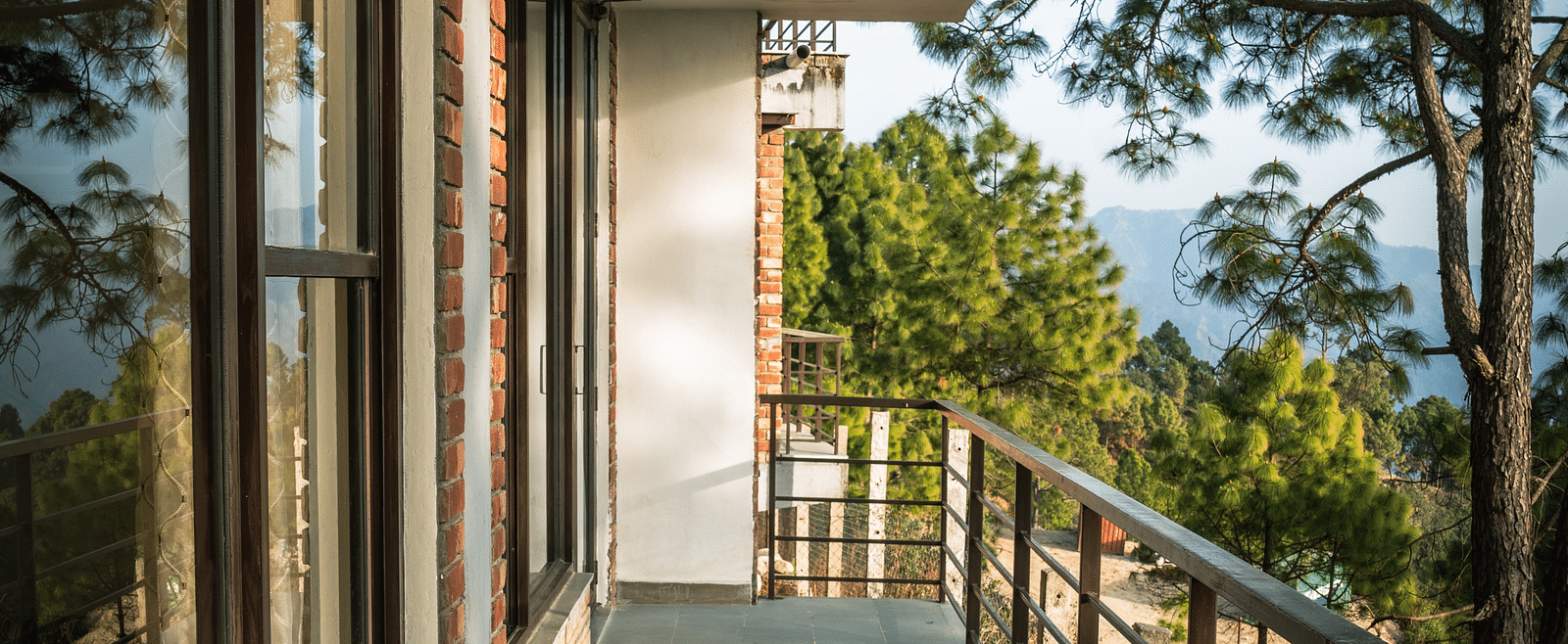 A suite balcony featuring a comfortable resting chair with a scenic view at A suite balcony featuring a comfortable resting chair with a scenic view.