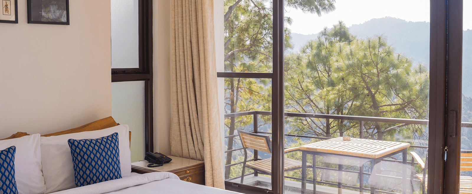 A bedroom featuring balcony at BluSalzz Escapade Resort, Lansdowne