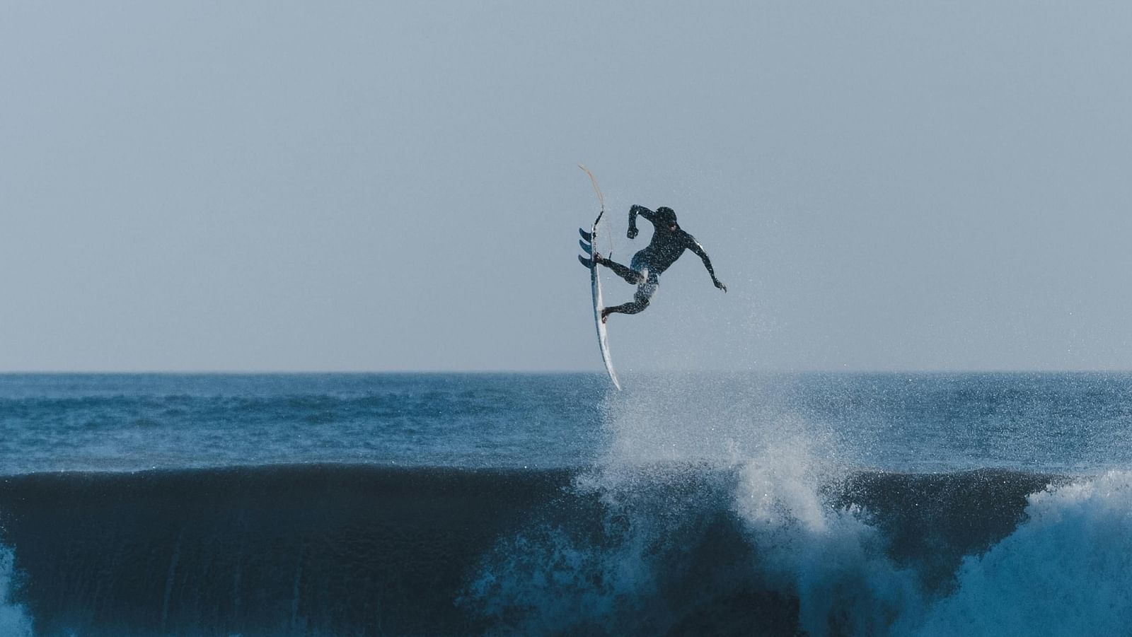 image of a person surfing in the ocean waves fabulously