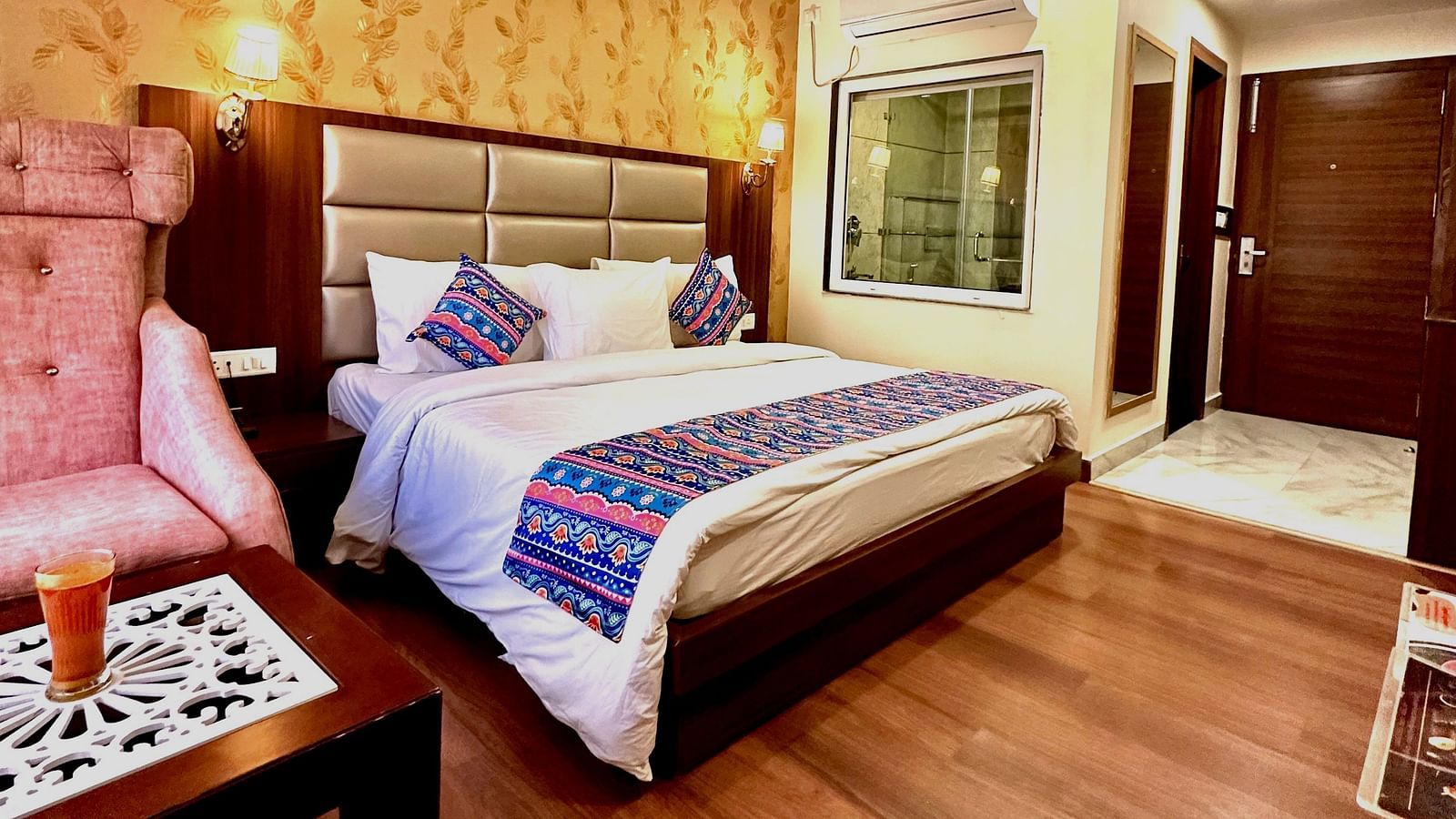 full view image of the superior room featuring a double bed and the entrance of the room - ZENQ SIGNATURE INN, MCLEODGANJ