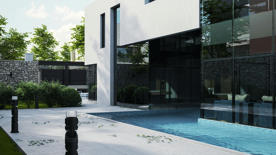 A modern building with large glass walls next to a swimming pool and an outdoor stone walkway.