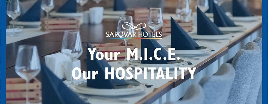 Sarovar Hotels & Resorts banner with the text Your MICE, Our Hospitality over a well-arranged dining setup in the background