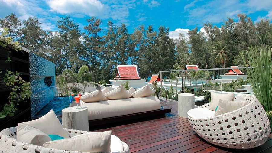 image of the private terrace with a cosy seating area - three bedroom private pool villa