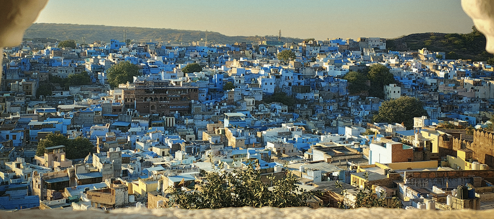 view of Jodhpur from an arched window at Mehrangarh Fort