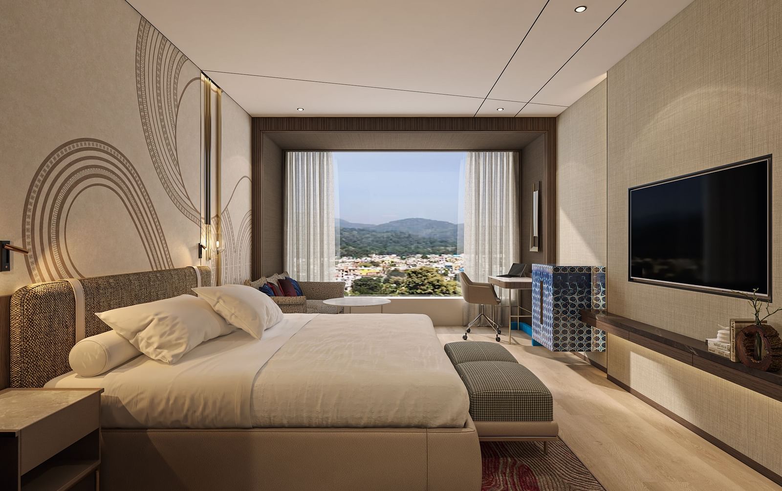 A side wide view of a double bed room with TV, rug, work desk and chair with a window overlooking an outside view