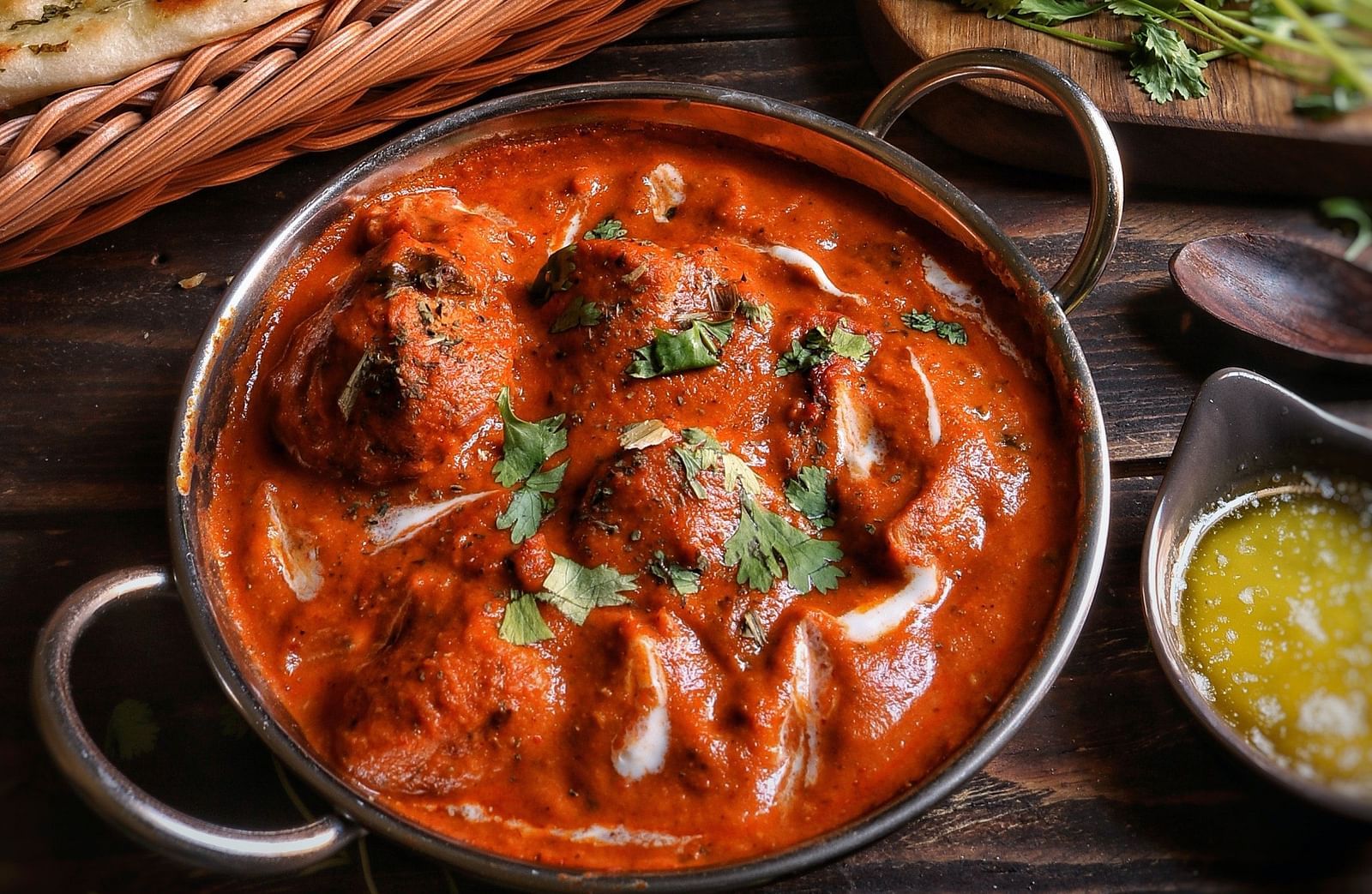 A mughlai delicacy served alongside some flatbread