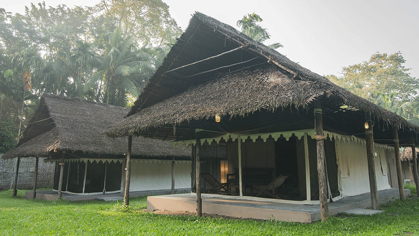 Exterior facade of Tented cottages with a garden in front of it at Barefoot at Havelock.