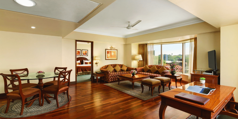 living room of the Deluxe Suite at Hotel Ramada Plaza Palm Grove Juhu Beach